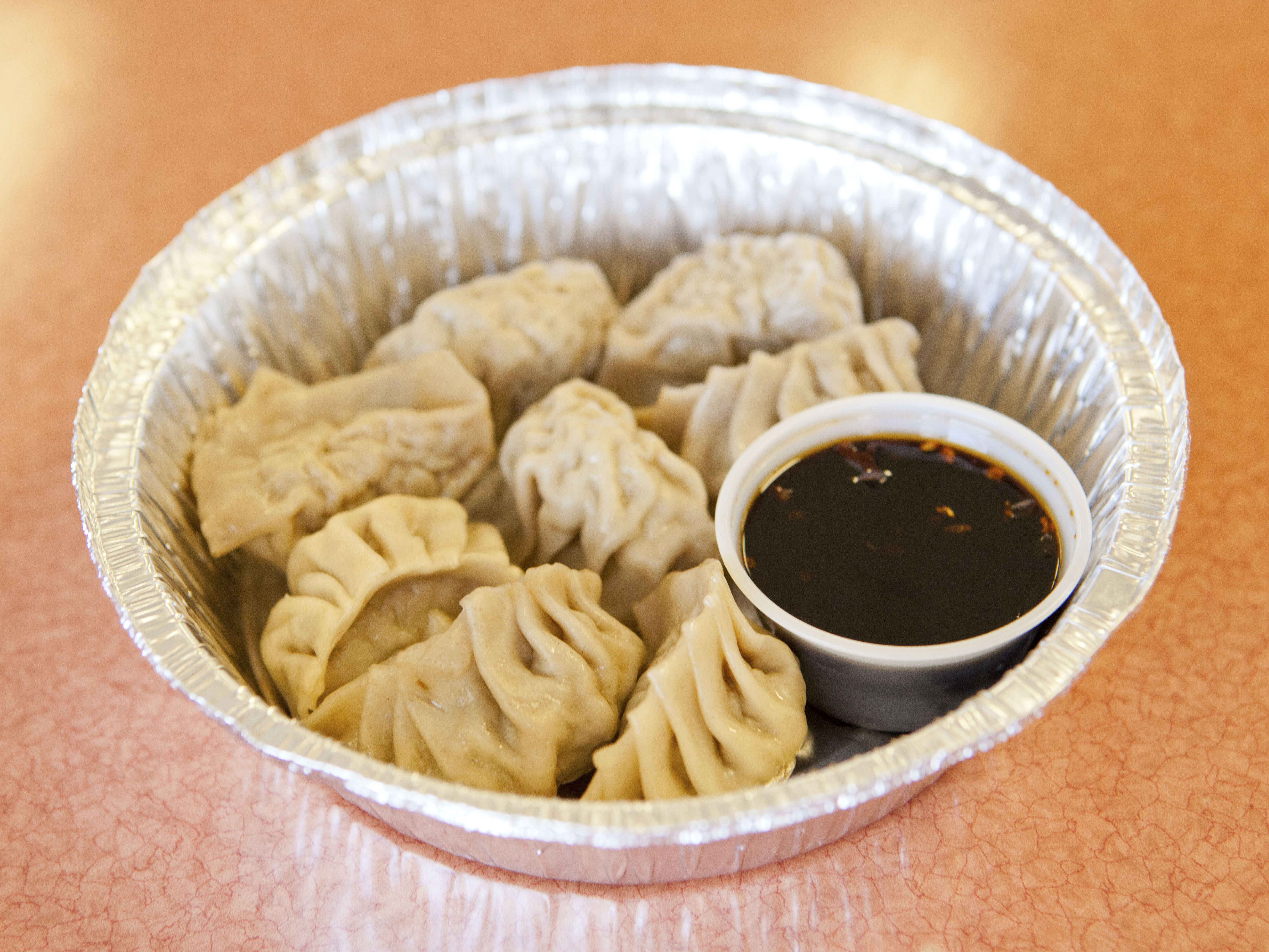 Order 6. 8 Steamed Dumplings food online from Hot Wok store, Tulsa on bringmethat.com