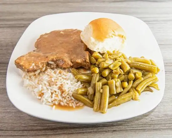 Order Smothered Pork Chop Dinner  food online from Big Country Bbq & Soulfood store, Stockbridge on bringmethat.com