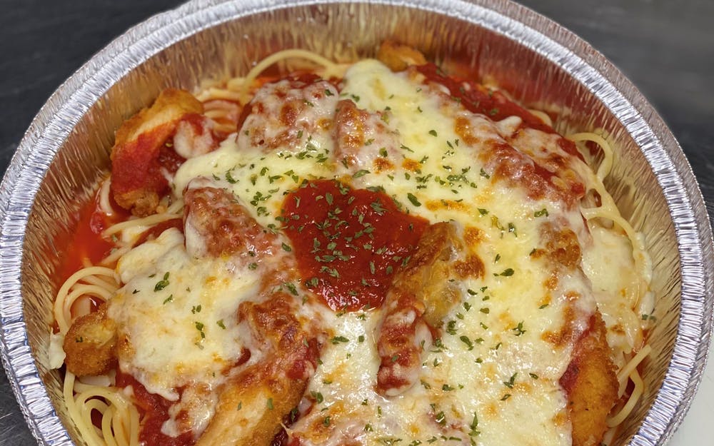 Order Chicken Parmesan over Spaghetti - Dinner food online from Three Brothers Italian Restaurant store, Bowie on bringmethat.com