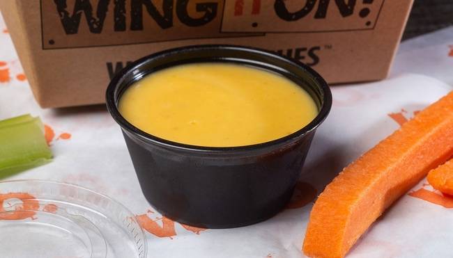 Order Honey Mustard Dressing - 2 oz food online from Wing It On store, New Britain on bringmethat.com