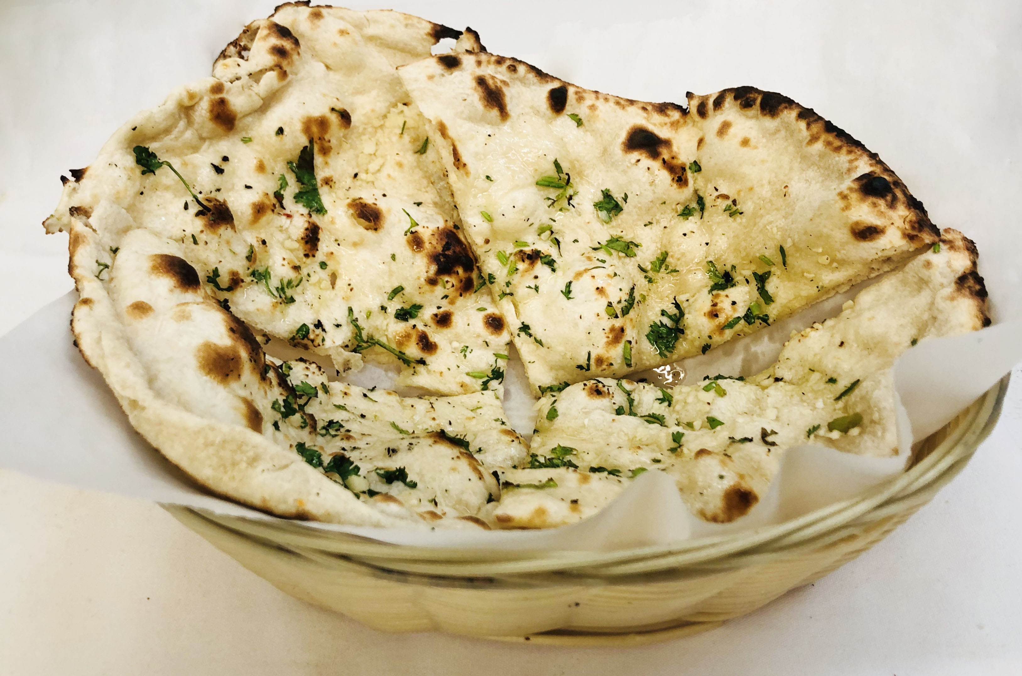 Order 3. Garlic Naan food online from Himalayan Grill store, Flagstaff on bringmethat.com