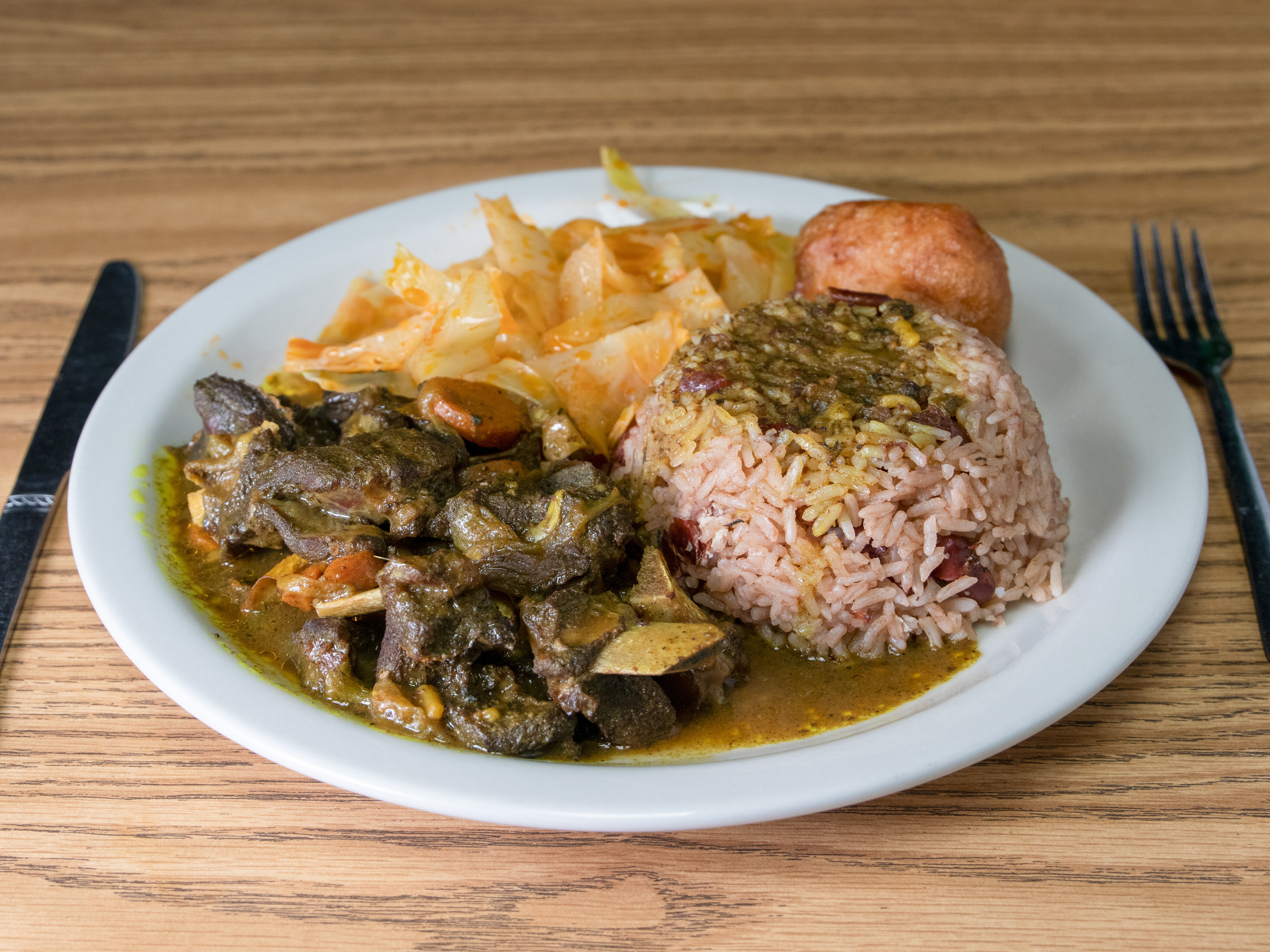 Order Curry Goat Tuesday Special food online from Jamaican & African Cuisine store, Jackson on bringmethat.com