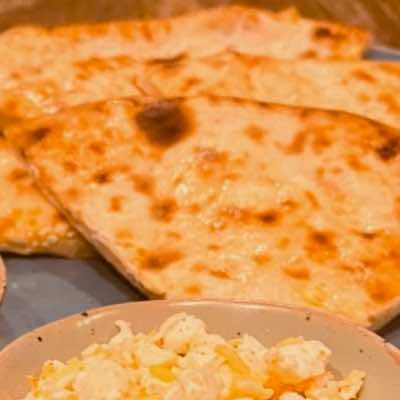 Order PANEER CHEESE NAAN (31) food online from Kabob & Curry store, Providence on bringmethat.com