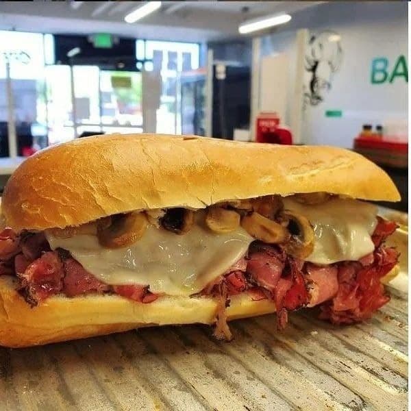 Order TUSCAN’S HOT PASTRAMI SUB food online from Basil Deli & Cafe store, Canoga Park on bringmethat.com