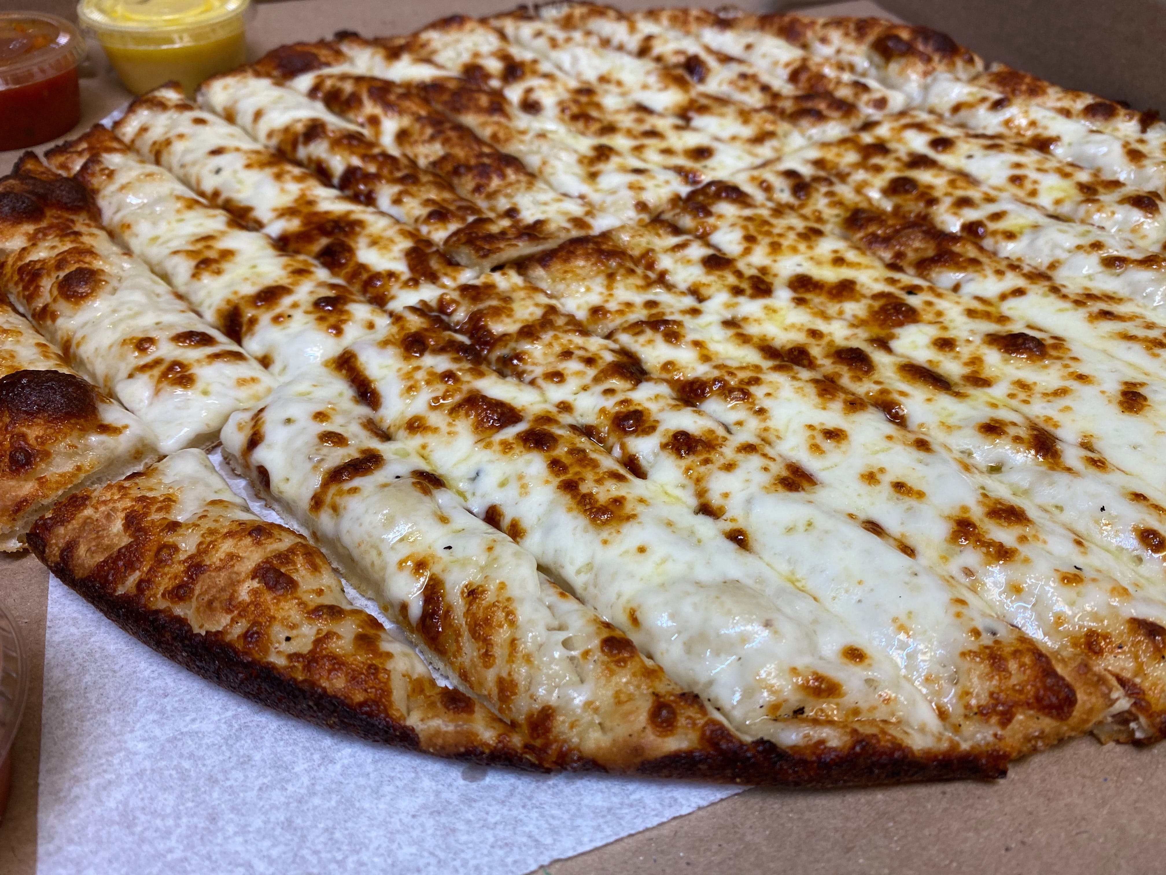 Order Cheesy Breadsticks - Small food online from Milano's Pizza store, Overton on bringmethat.com
