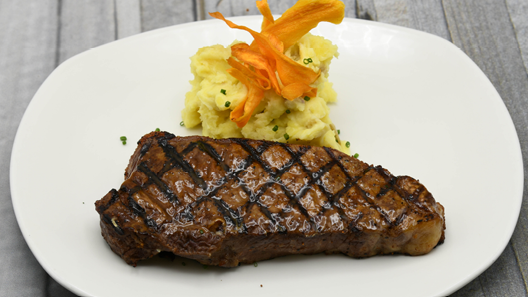 Order NY Strip 14 oz food online from Chart House store, Savannah on bringmethat.com