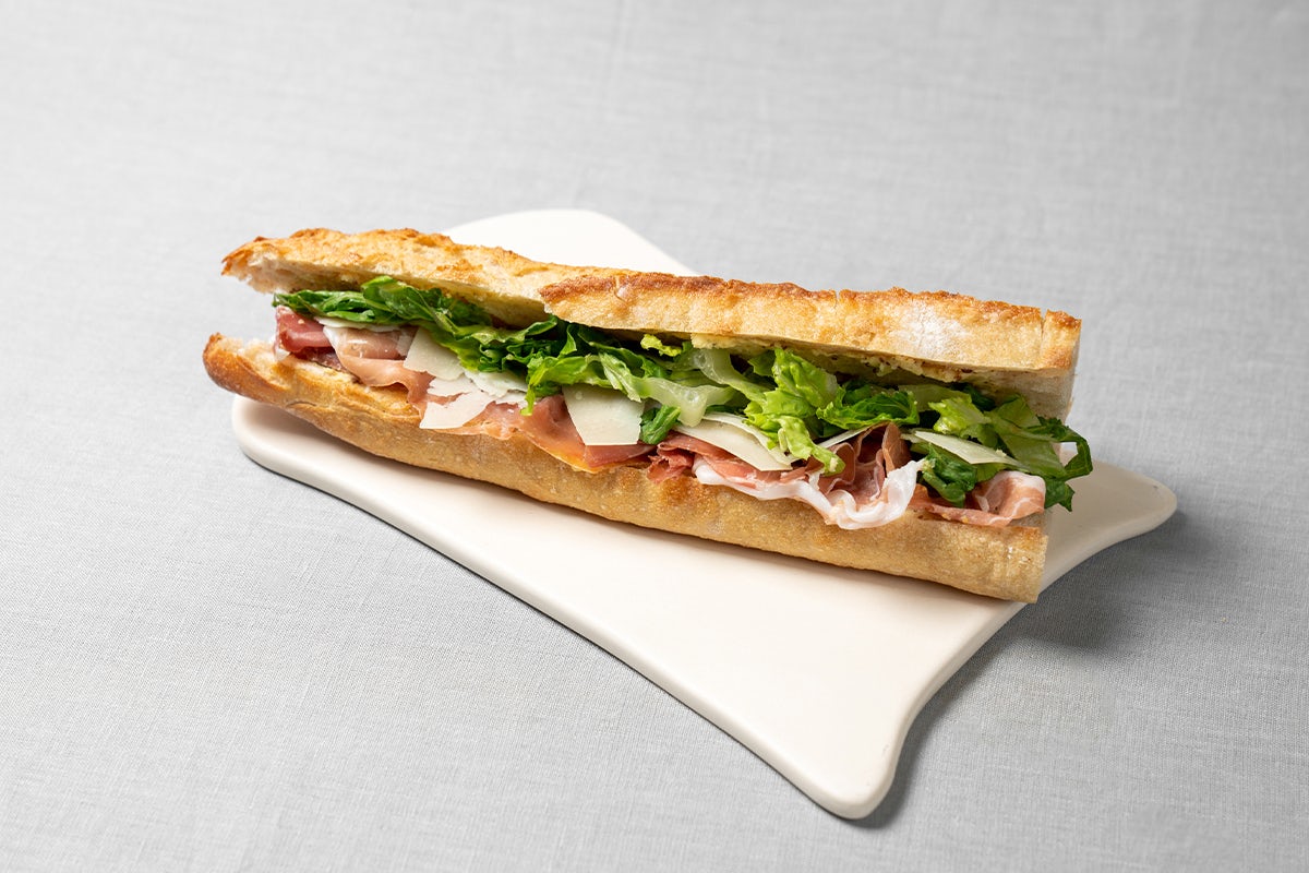 Order Prosciutto Manchego Baguette food online from Le Pain Quotidien store, Garden City on bringmethat.com