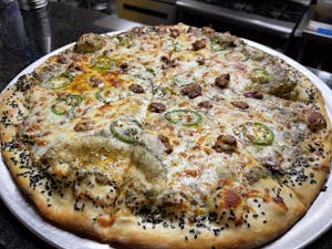Order Nico Suave Pizza food online from Cueva Bar store, San Diego on bringmethat.com