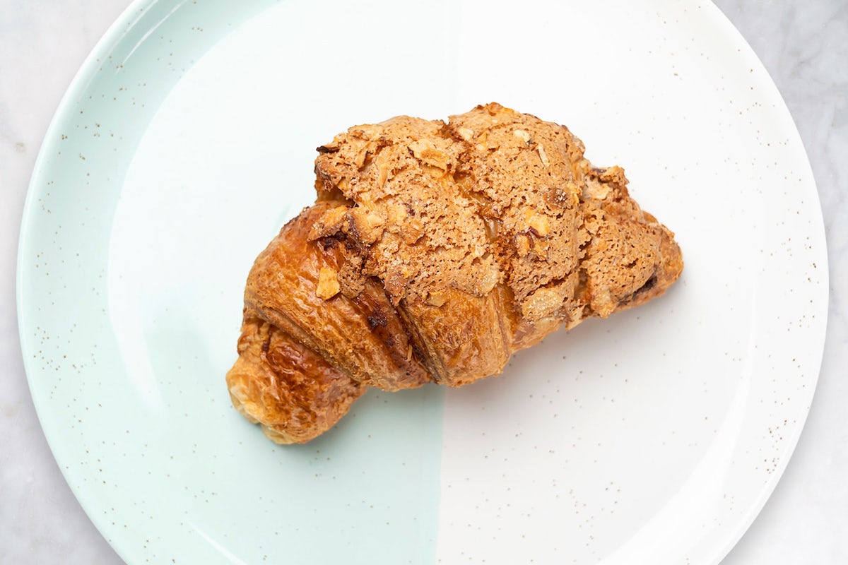 Order Almond Croissant food online from Coffee shop store, New York on bringmethat.com