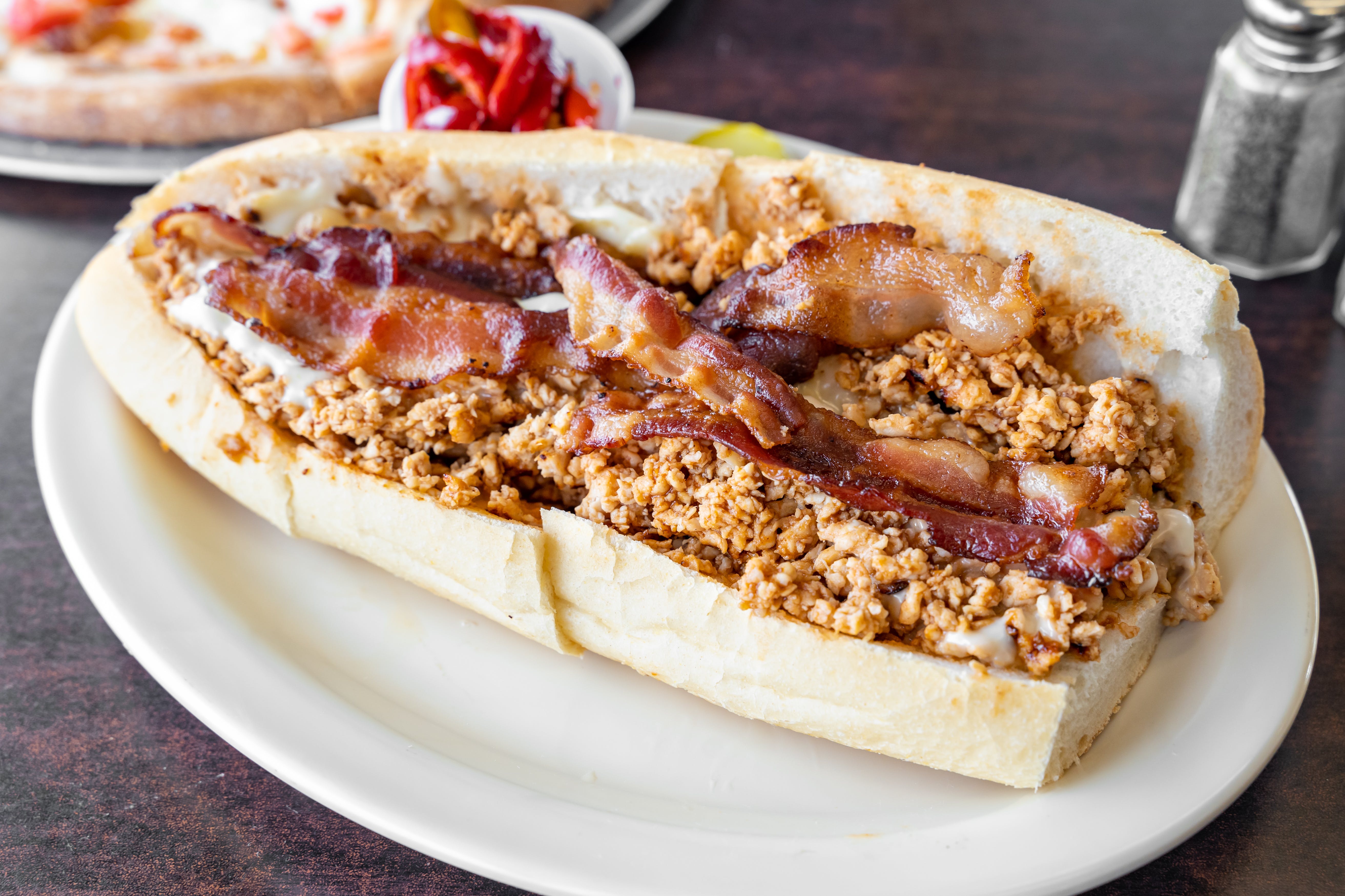 Order BBQ Chicken Cheesesteak Sandwich with Bacon - Half 10" food online from Steak Out store, Sewell on bringmethat.com