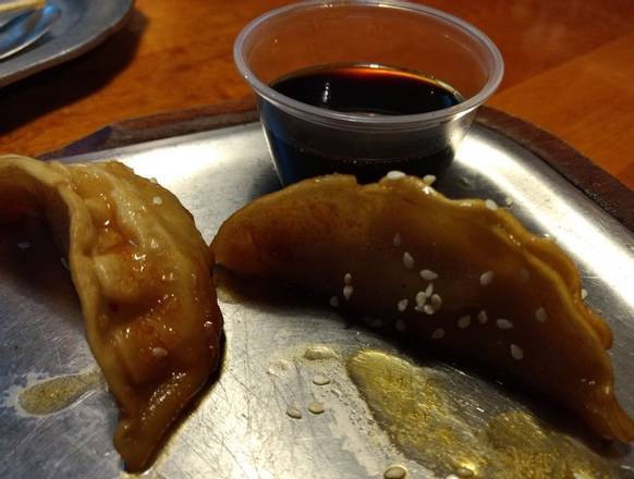Order Half portion Pork Dumplings  food online from The Stone Soup Company (Ybor City) store, Tampa on bringmethat.com