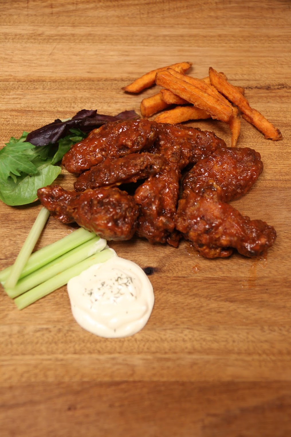 Order Mexican Chipotle Wings food online from The Burger Joint store, New York on bringmethat.com