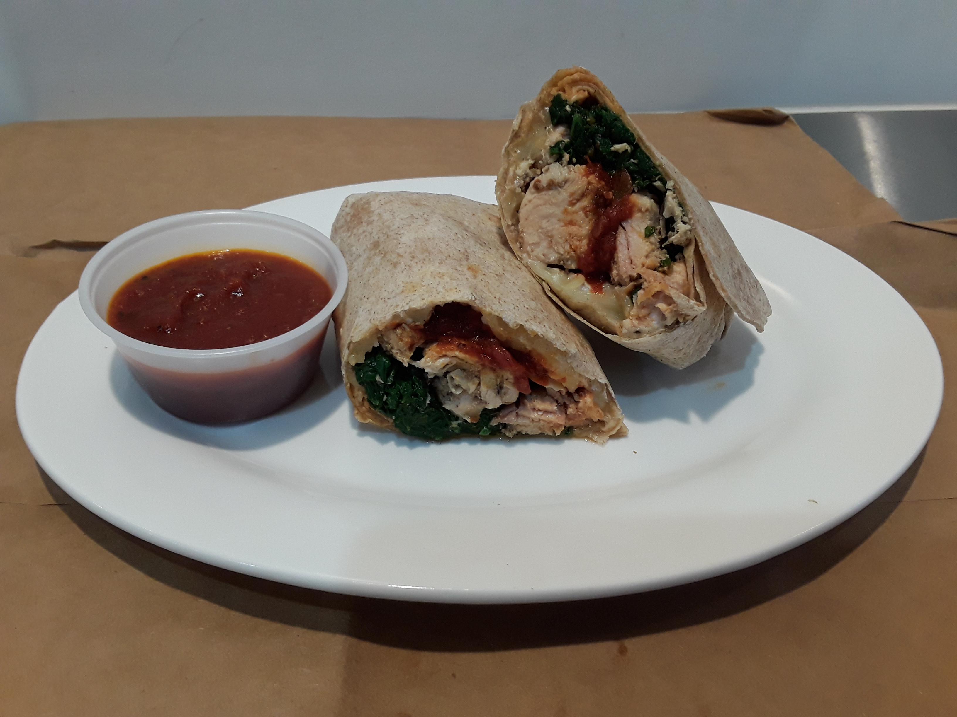 Order Chicken Spinach Wrap food online from Eva's health food store, New York on bringmethat.com