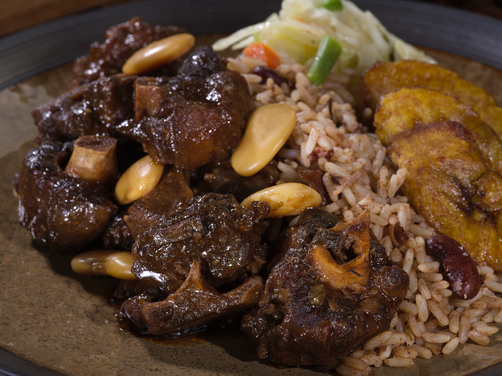 Order Braised Oxtail Meal food online from Golden Krust store, Raleigh on bringmethat.com