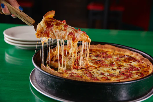 Order 12" Chicago Pan Pizza  food online from Oregano's Pizza Bistro store, Tempe on bringmethat.com
