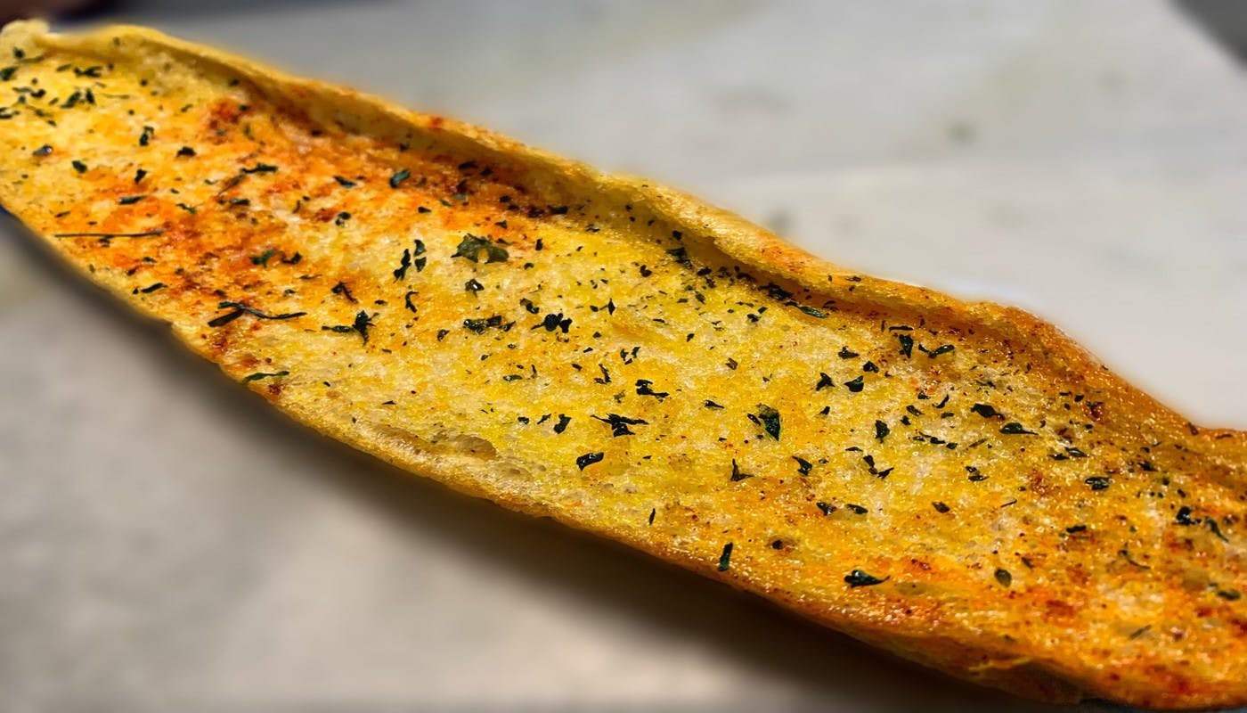 Order Homemade Garlic Bread - 12" Loaf food online from Village Pizza & Seafood store, Dickinson on bringmethat.com