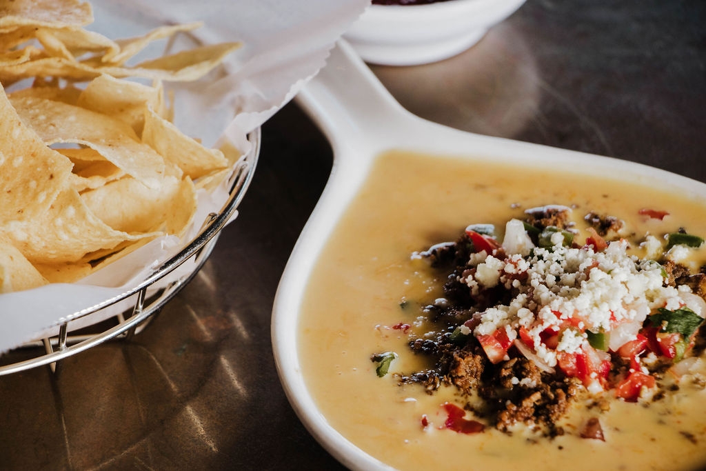 Order Chile con Queso Deluxe food online from Roja Mexican Grill store, Omaha on bringmethat.com