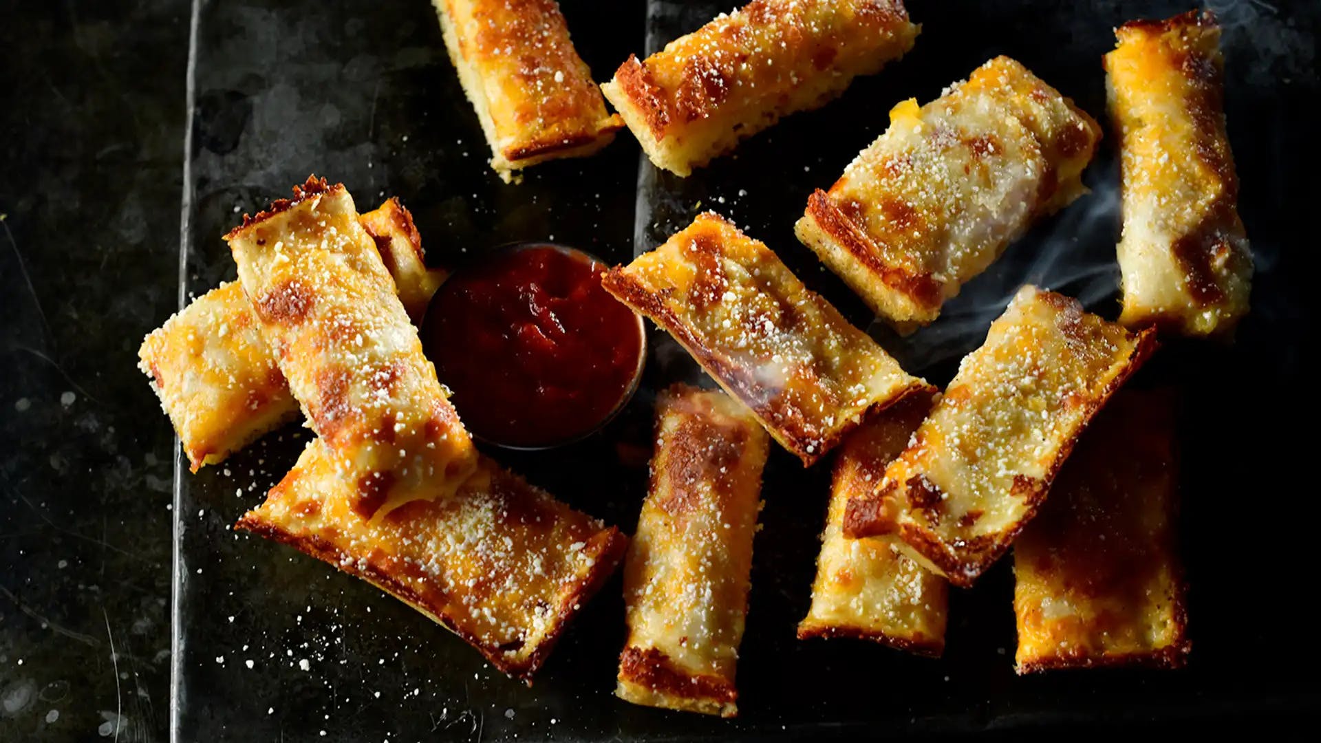 Order Jet's Triple Cheese Turbo Stix® - 12 Pieces food online from Jet's Pizza store, Ann Arbor on bringmethat.com