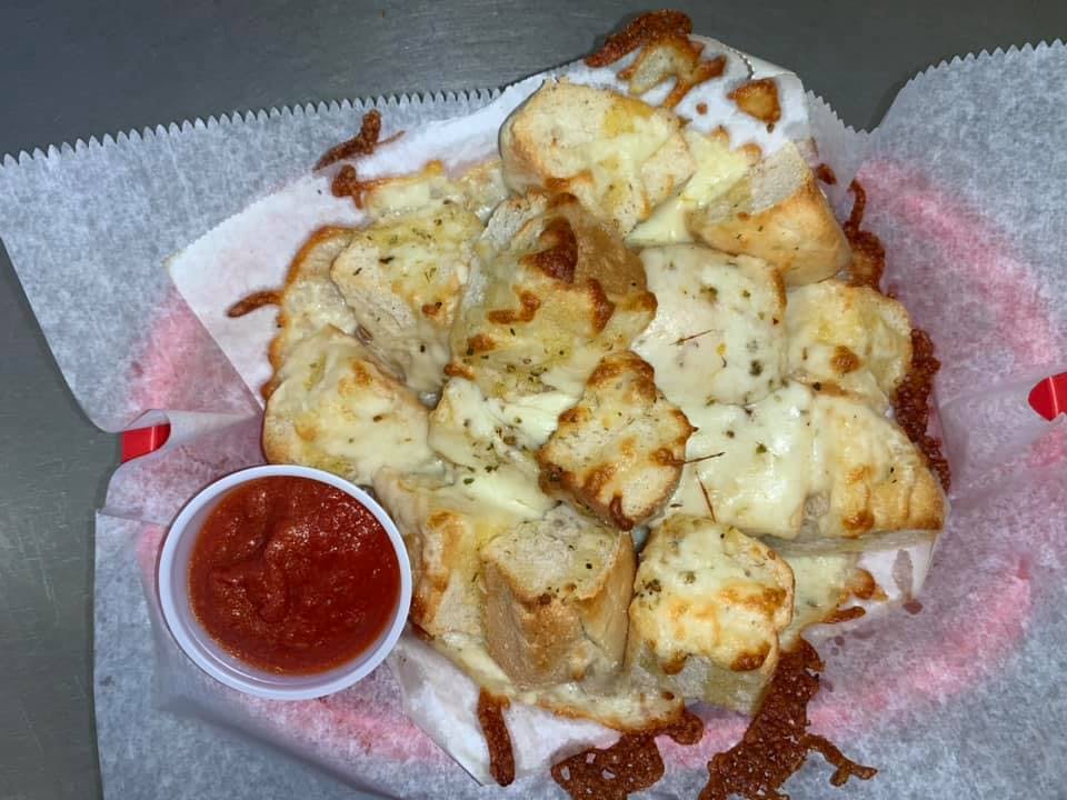 Order Garlic Loaf with Cheese - Small food online from Saucy Sisters Pizzeria store, Leesburg on bringmethat.com