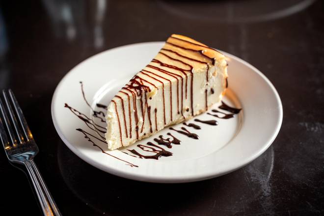 Order Cheesecake with Chocolate Syrup food online from The Pasta Bowl store, Chicago on bringmethat.com