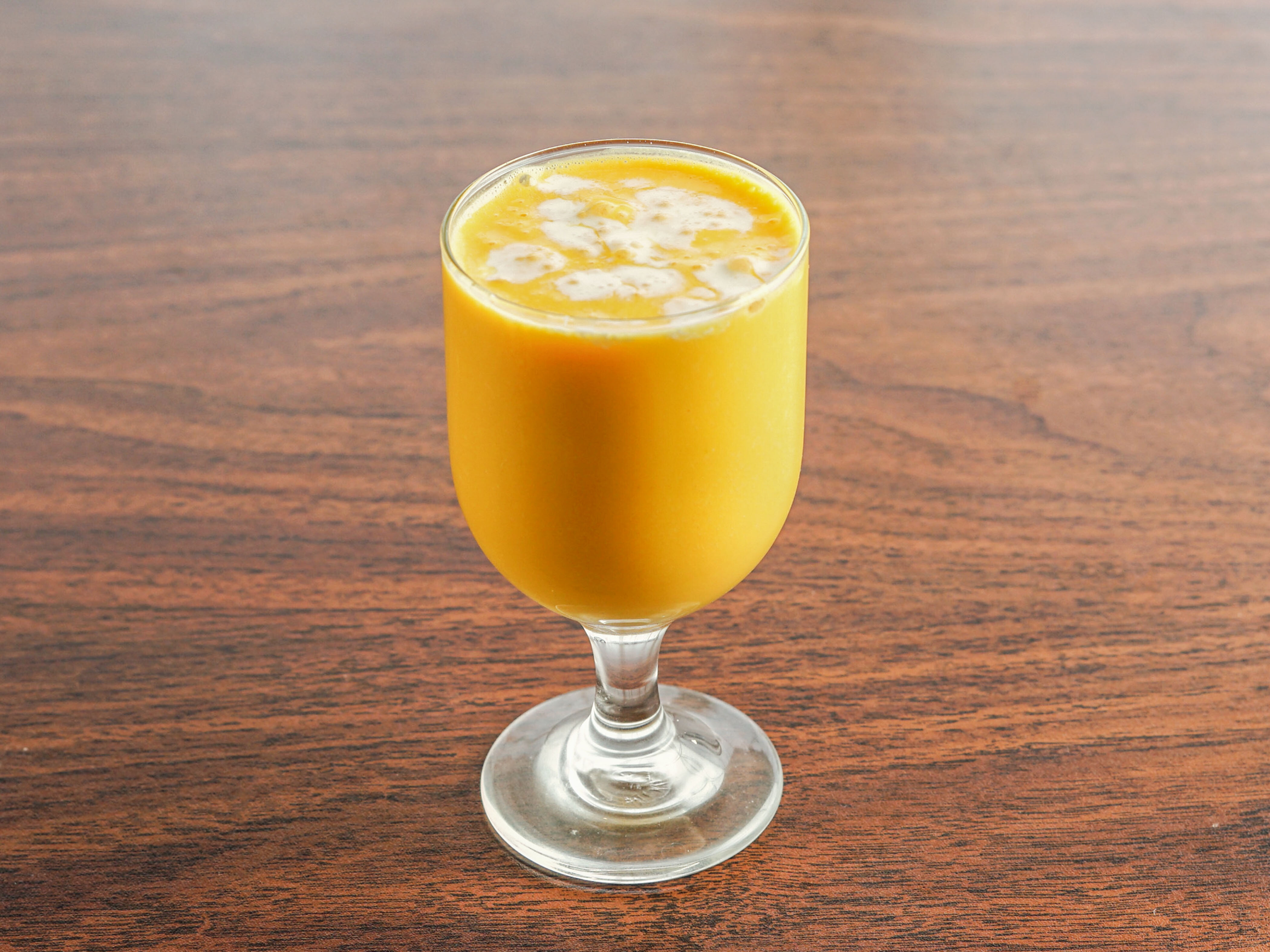 Order E4. Mango Lassi food online from Kitchen of India store, Parkville on bringmethat.com