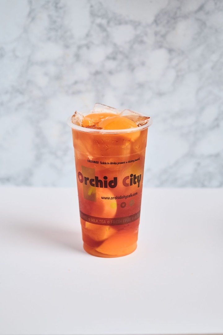 Order OC Peach Red Tea food online from Orchid City Fusion Cafe store, Arlington on bringmethat.com