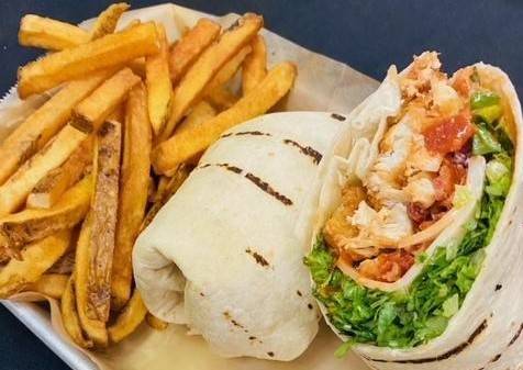 Order Bayou Chicken Wrap food online from The Quarter Bar & Grill store, Addison on bringmethat.com