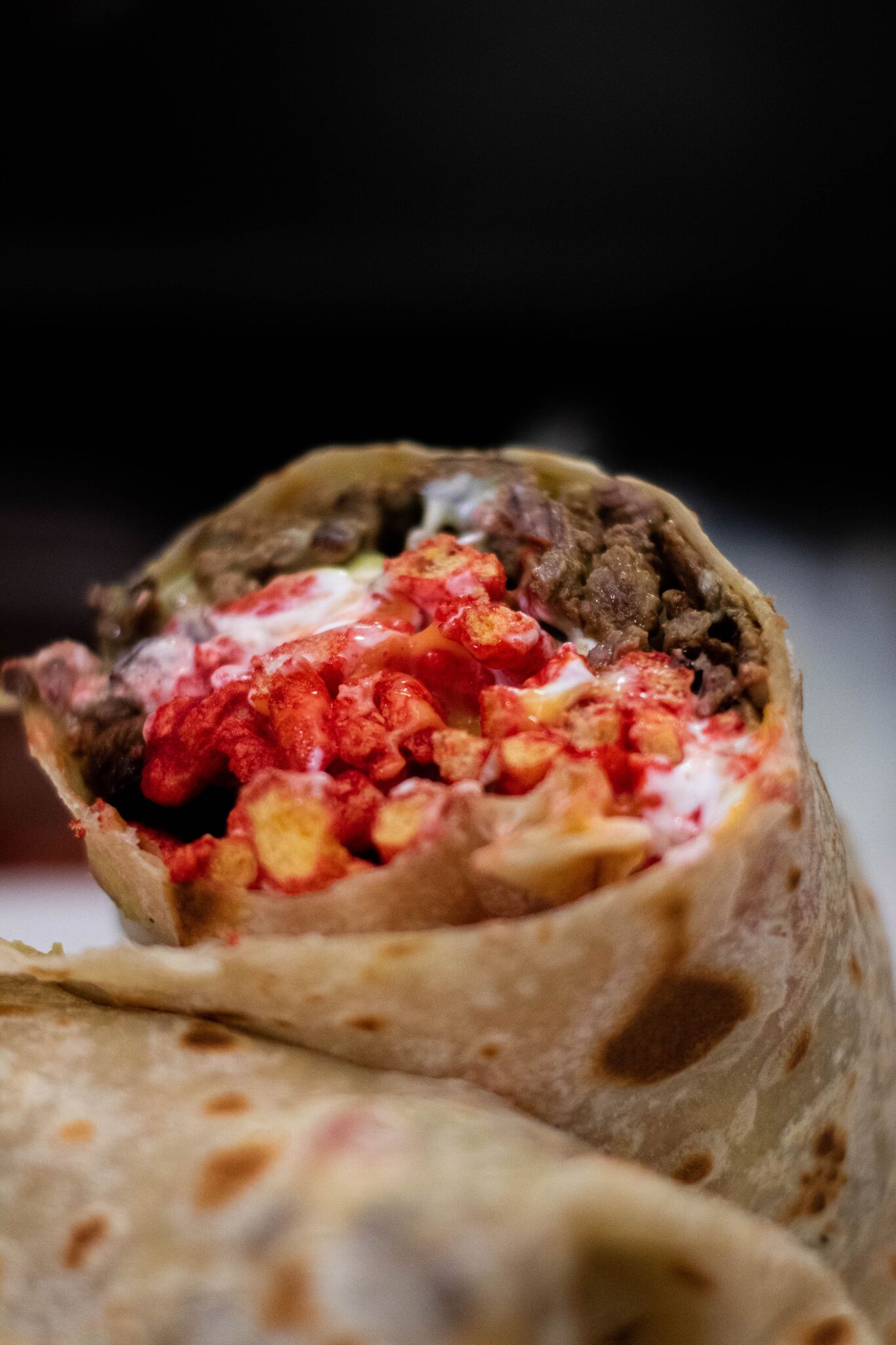 Order Hot Cheetos Burrito food online from Sayulitas Mexican Food store, San Diego on bringmethat.com
