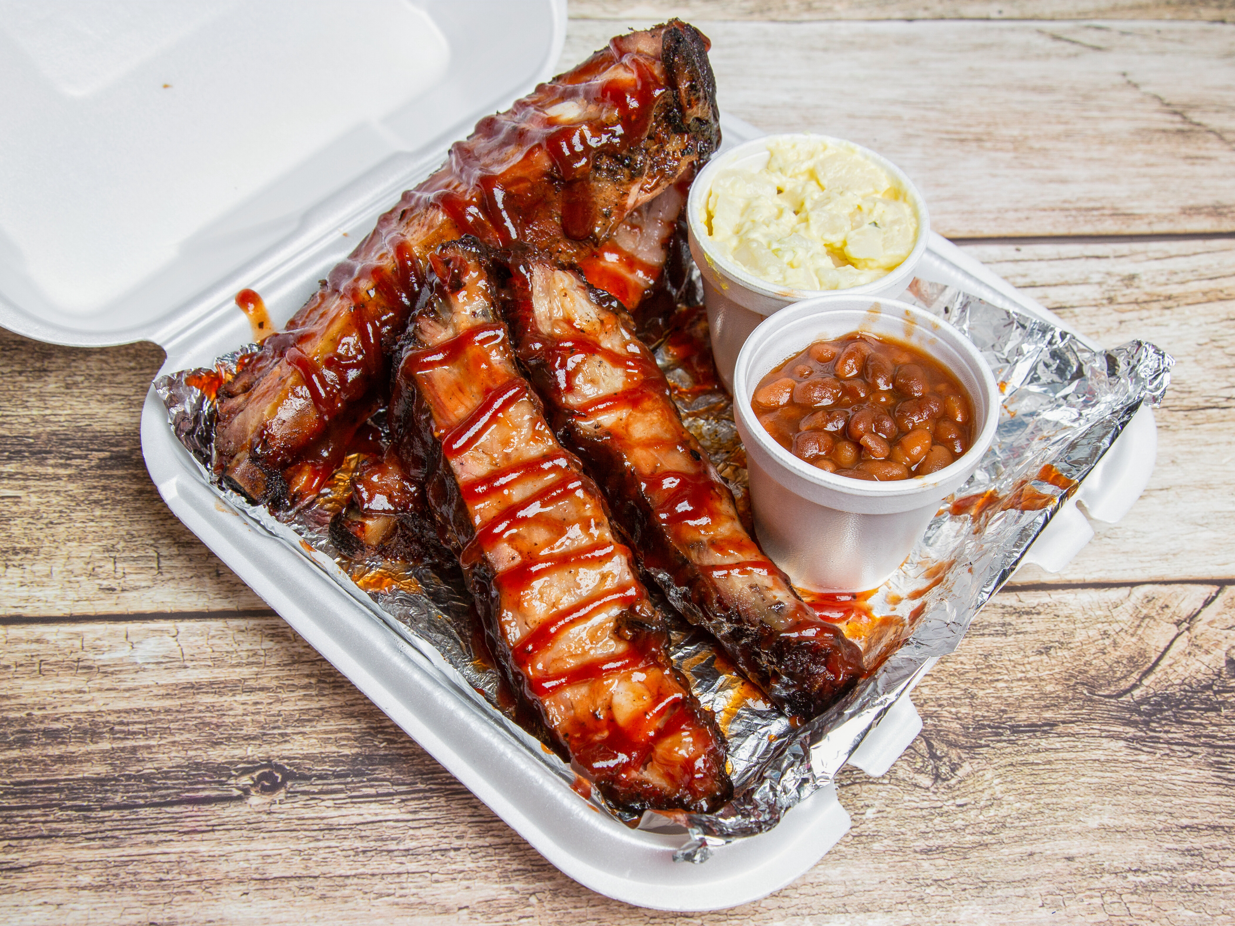 Order Rib Dinner 4 Bones and 2 Sides food online from Family Ties Of Louisville store, Louisville on bringmethat.com