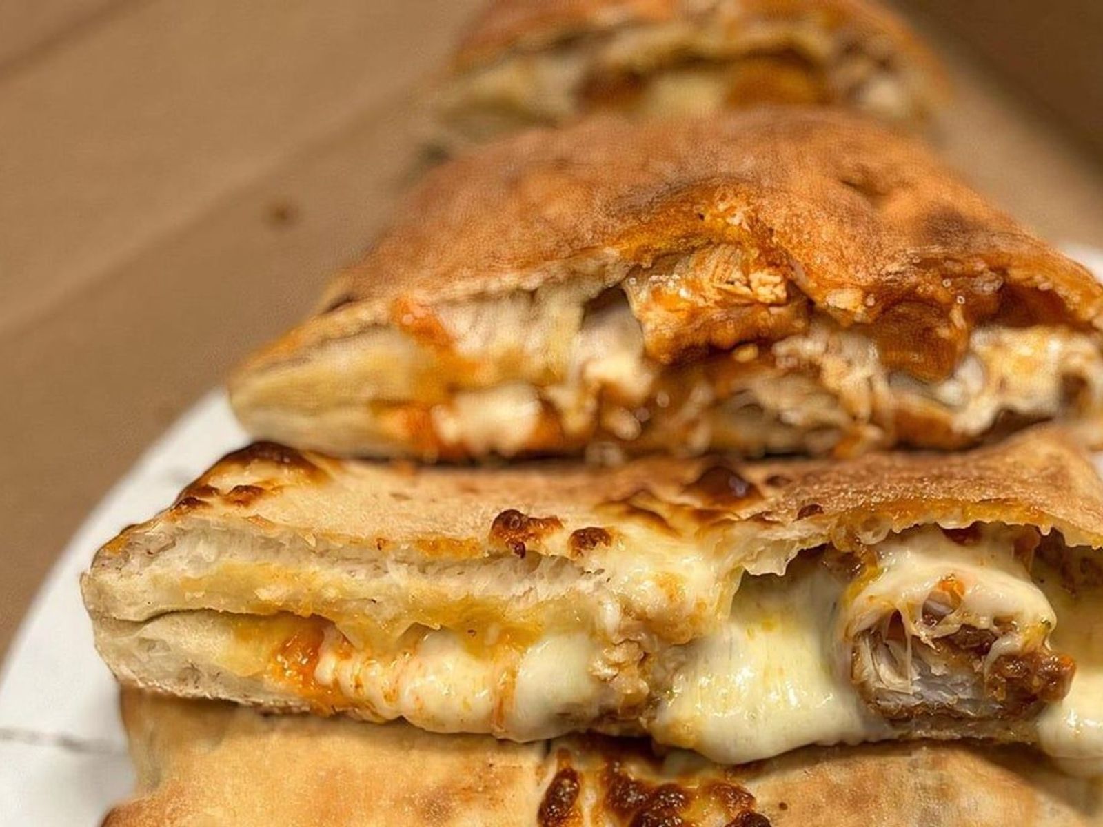 Order CHICKEN PARM CALZONE food online from Lisa's Family Pizzeria store, Wakefield on bringmethat.com