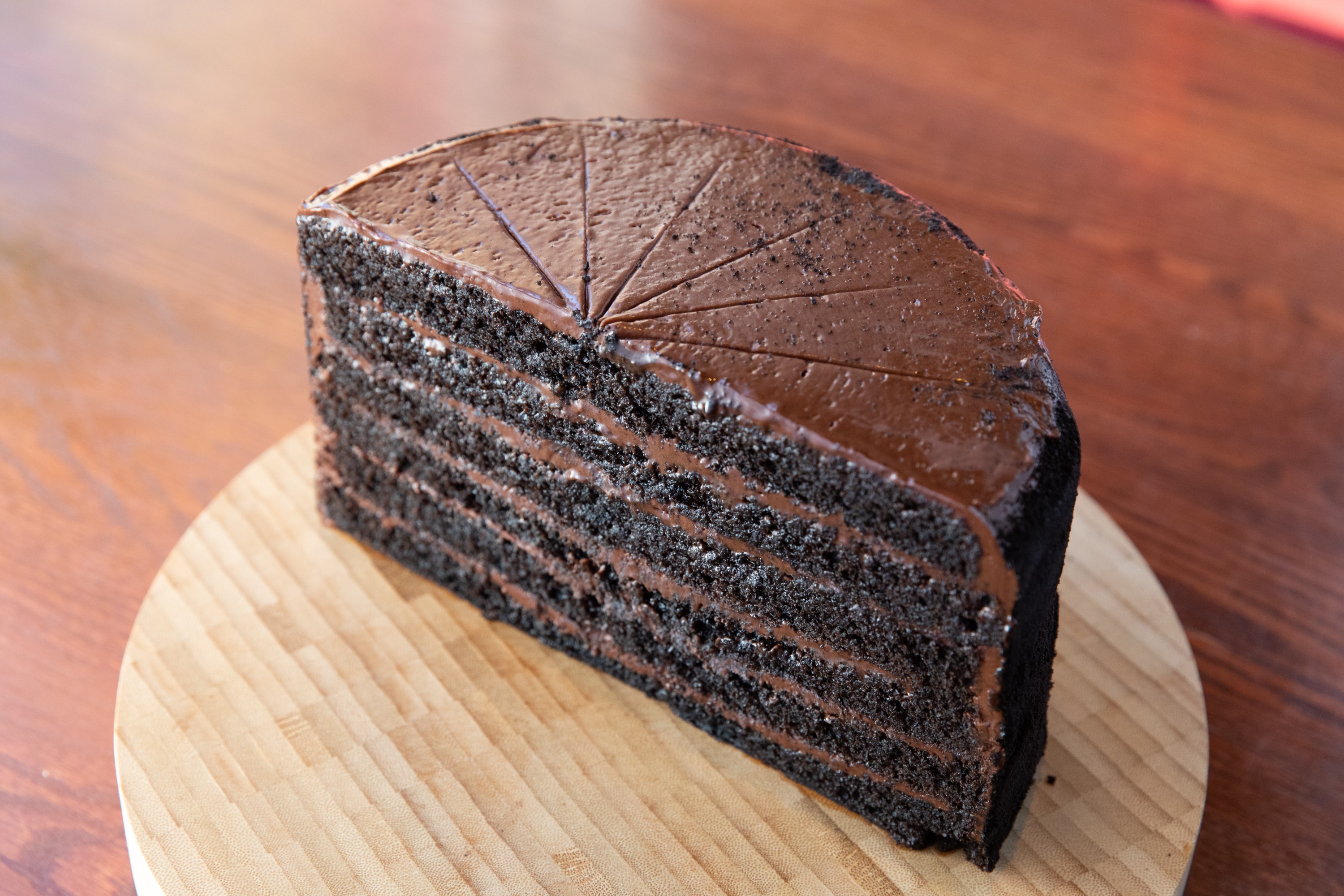 Order 5025. Leaning Tower of Chocolate Cake food online from Smokey Bones BBQ store, Orlando on bringmethat.com