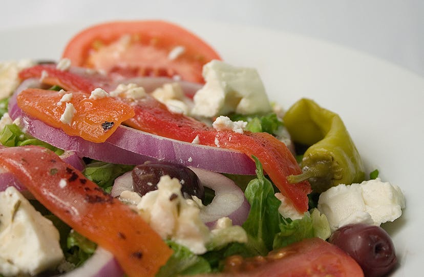 Order Astoria Greek Salad - Large food online from NYPD Pizza store, Orlando on bringmethat.com