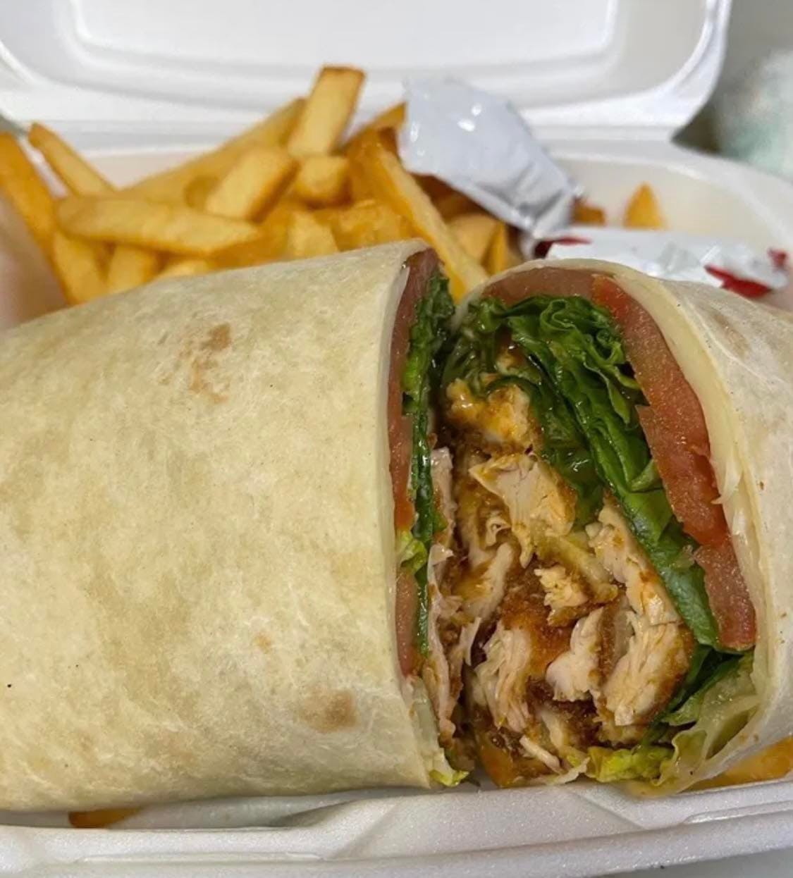 Order Chicken Genovese Wrap - Wraps food online from Saybrook Pizza & Restaurant store, Old Saybrook on bringmethat.com