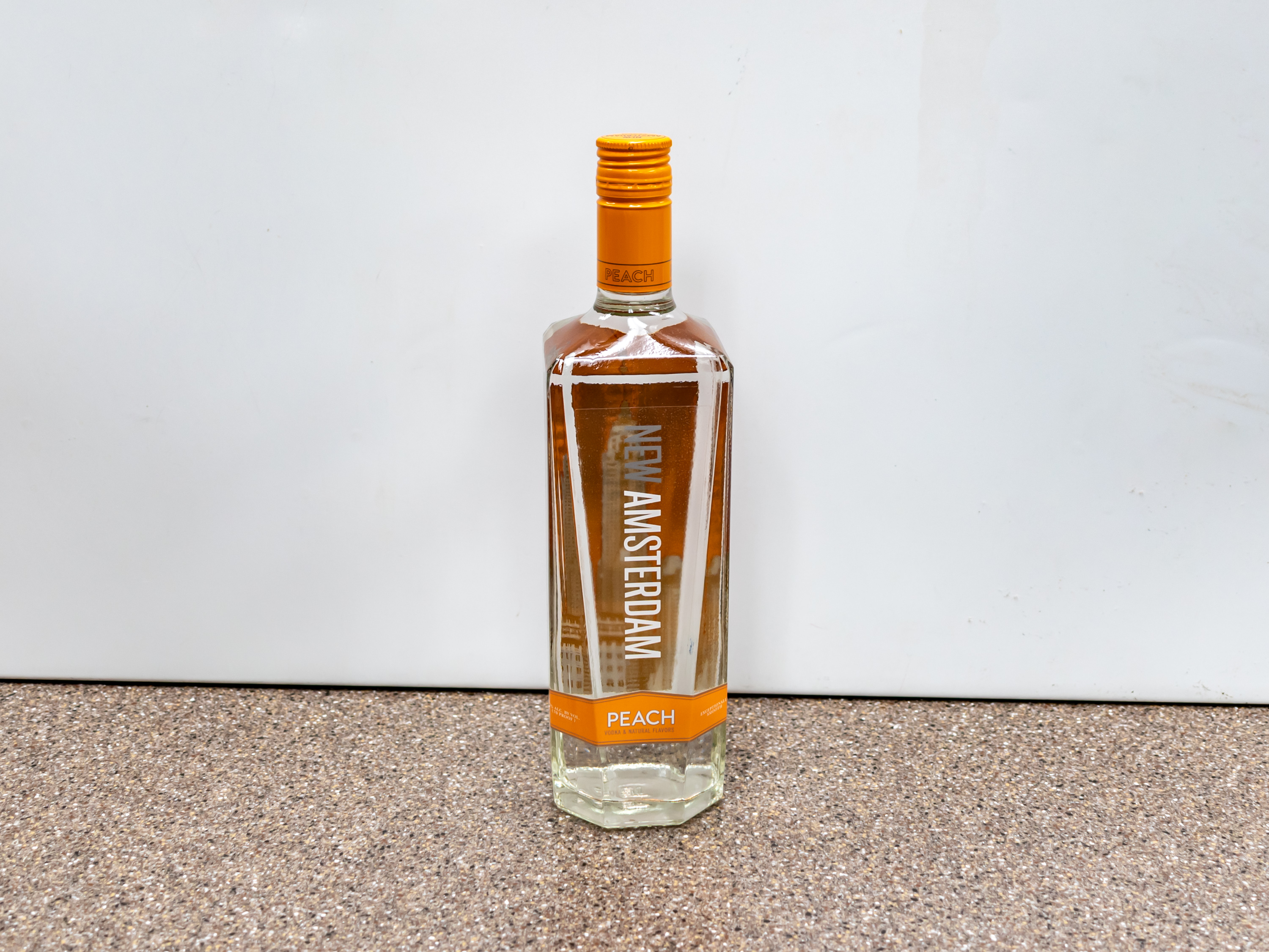 Order New Amsterdam Peach Vodka food online from Kangaroo Food Mart store, Cathedral City on bringmethat.com