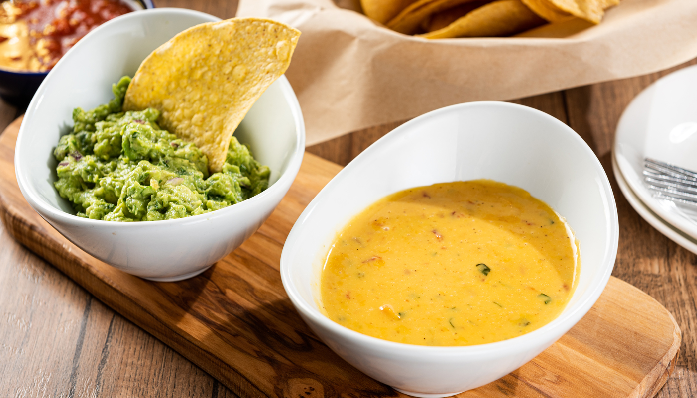 Order Guacamole and Queso Duo food online from On The Border store, Las Vegas on bringmethat.com