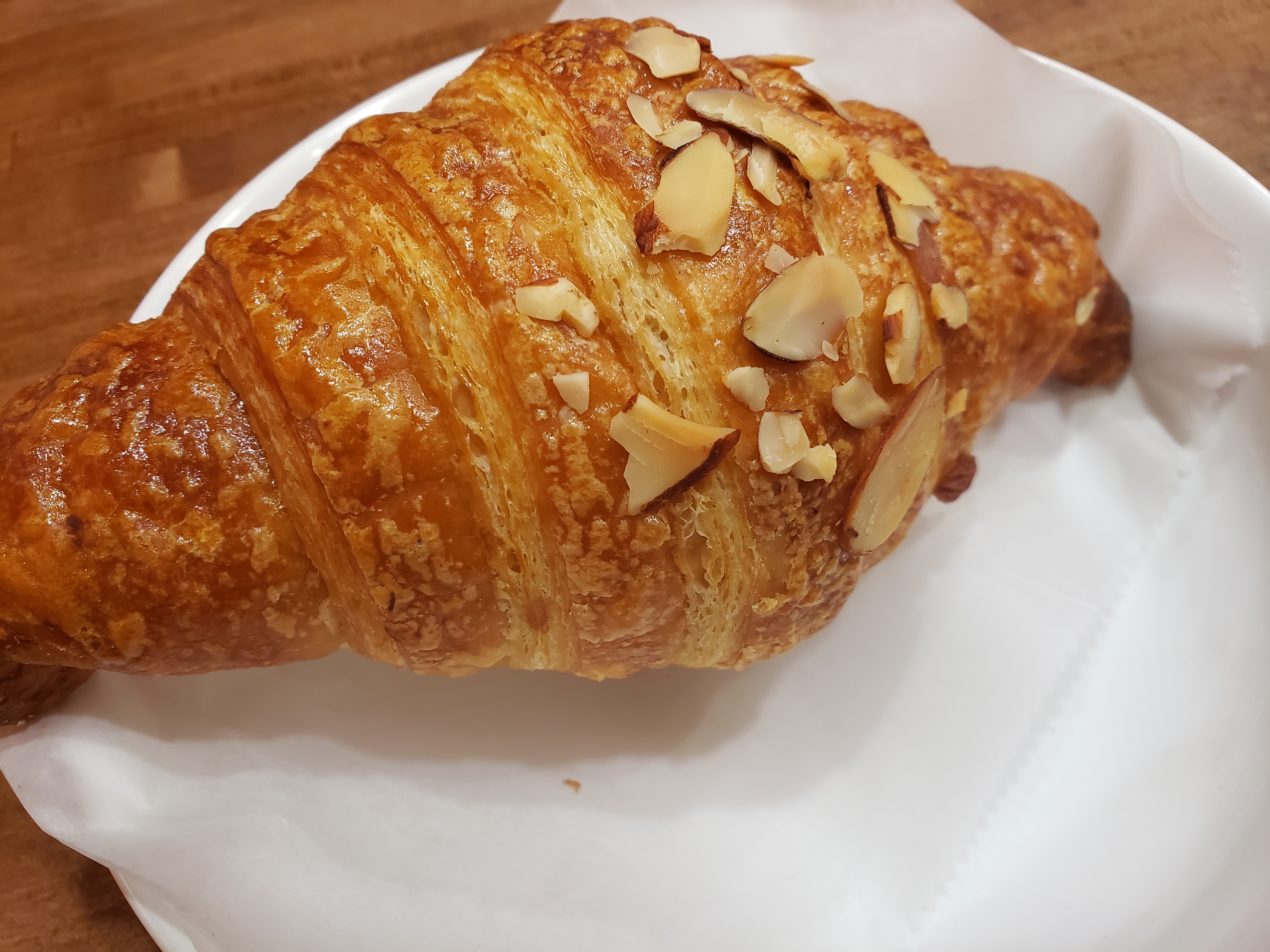 Order Almond Croissant  food online from Torch Wood Cafe store, Philadelphia on bringmethat.com