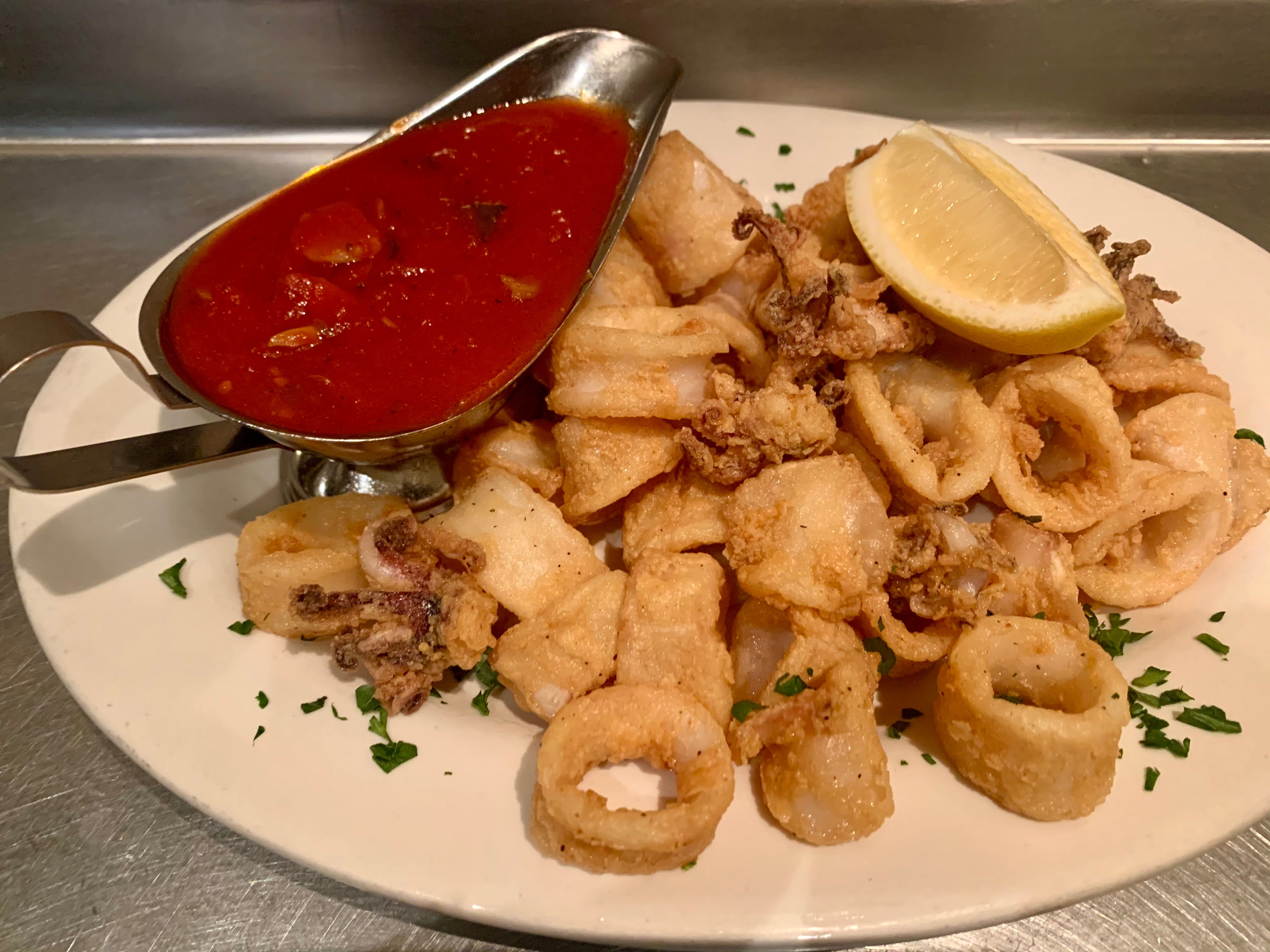 Order Fried Calamari - Appetizer food online from Gino's Of Tuscany store, Bethpage on bringmethat.com