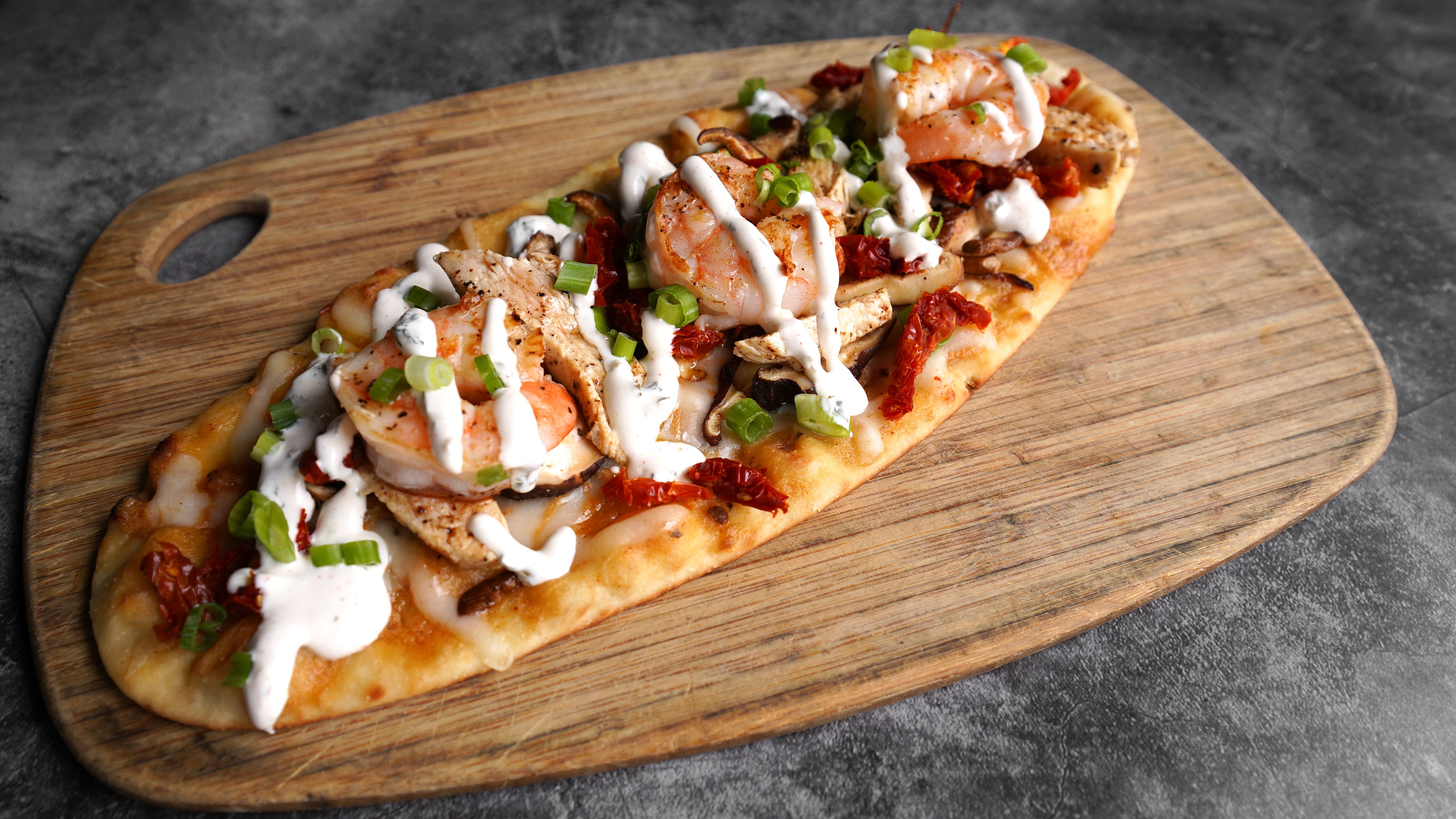 Order Spicy Shrimp and Chicken Flatbread food online from La Bowls And Breads store, Los Angeles on bringmethat.com