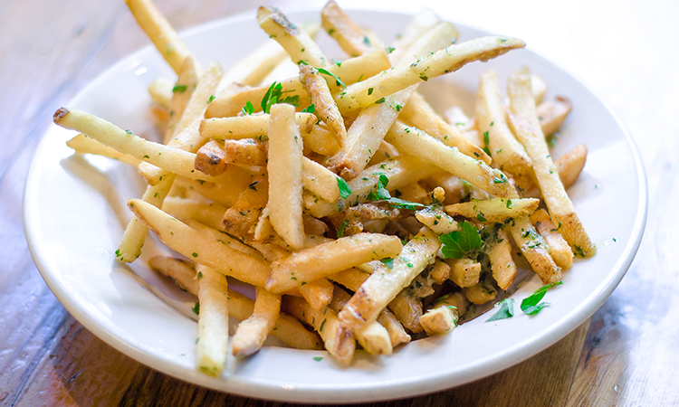Order Garlic French Fries food online from Elephants Delicatessen At World Trade Center store, Portland on bringmethat.com