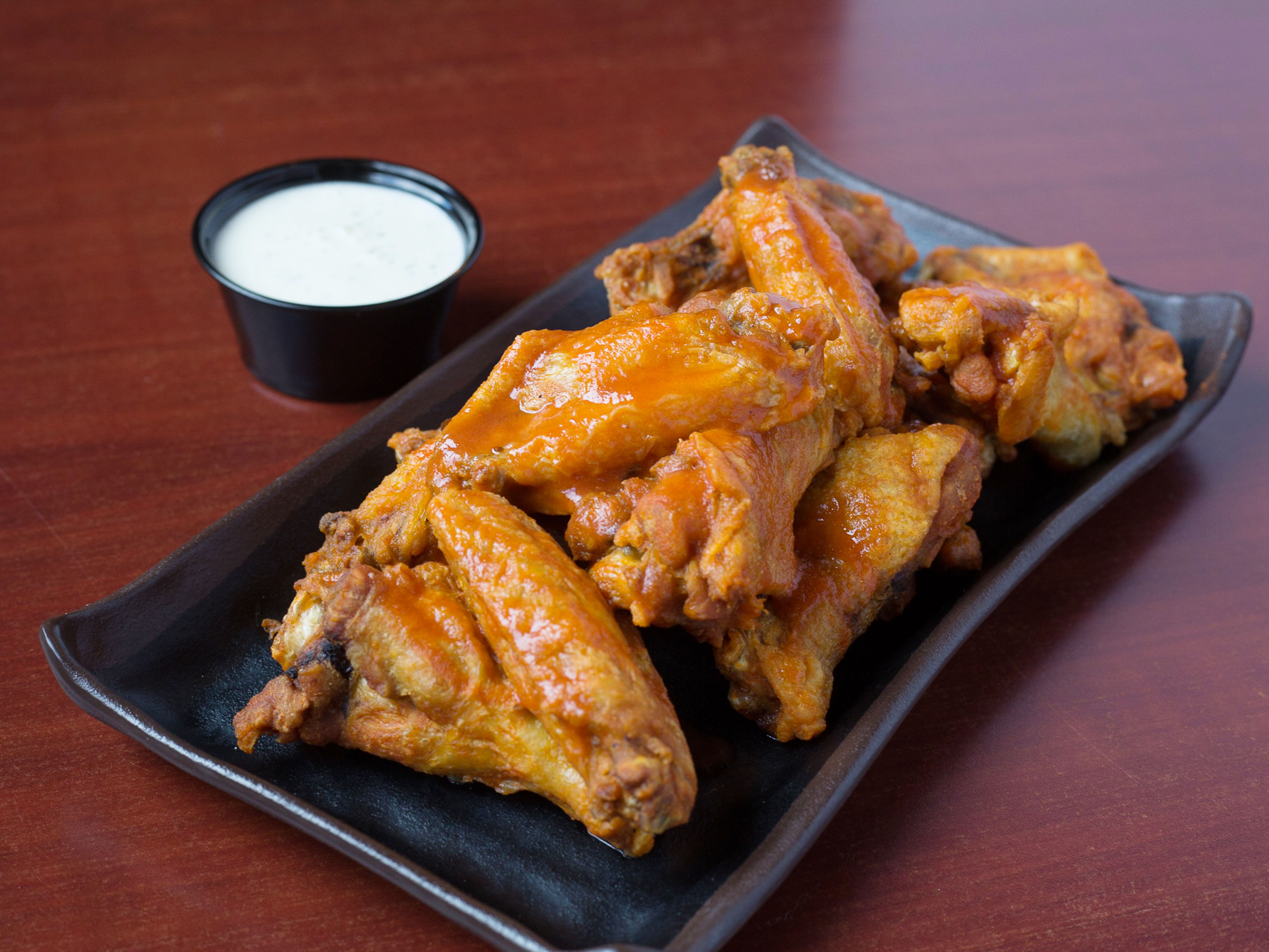 Order 10 Bone In Wings food online from Coaches Burger Bar store, Youngstown on bringmethat.com