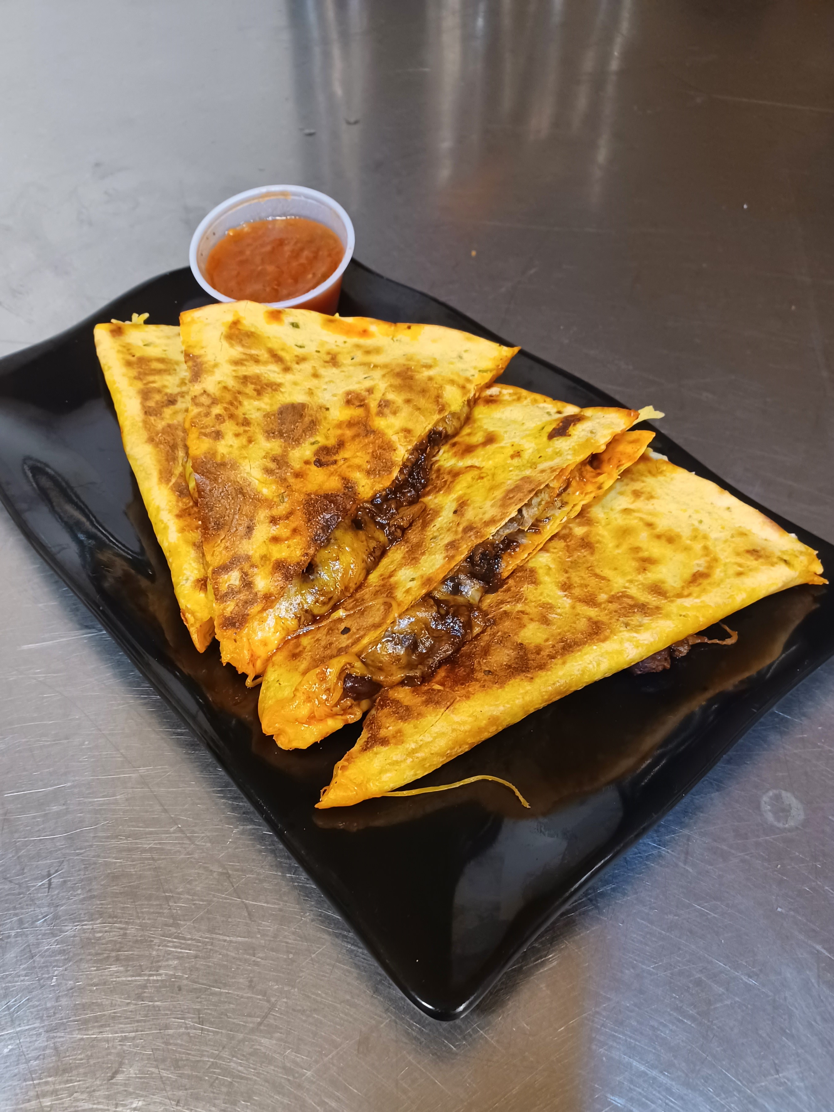 Order Iron Giant Quesadilla food online from Muddaddy Flats store, Troy on bringmethat.com