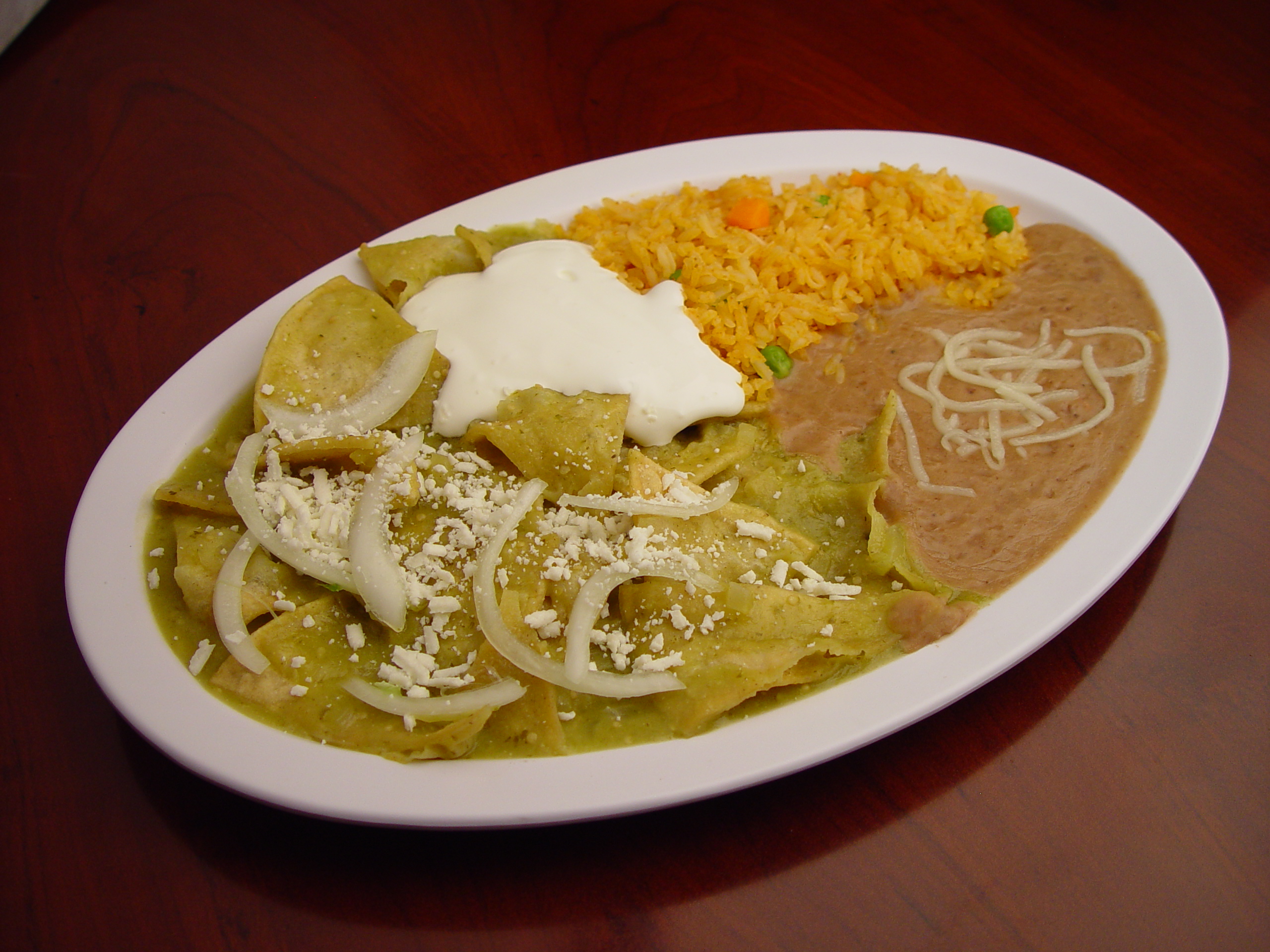 Order Green Chilaquiles con Carne Asada food online from Rodeo Mexican Grill store, Los Angeles on bringmethat.com
