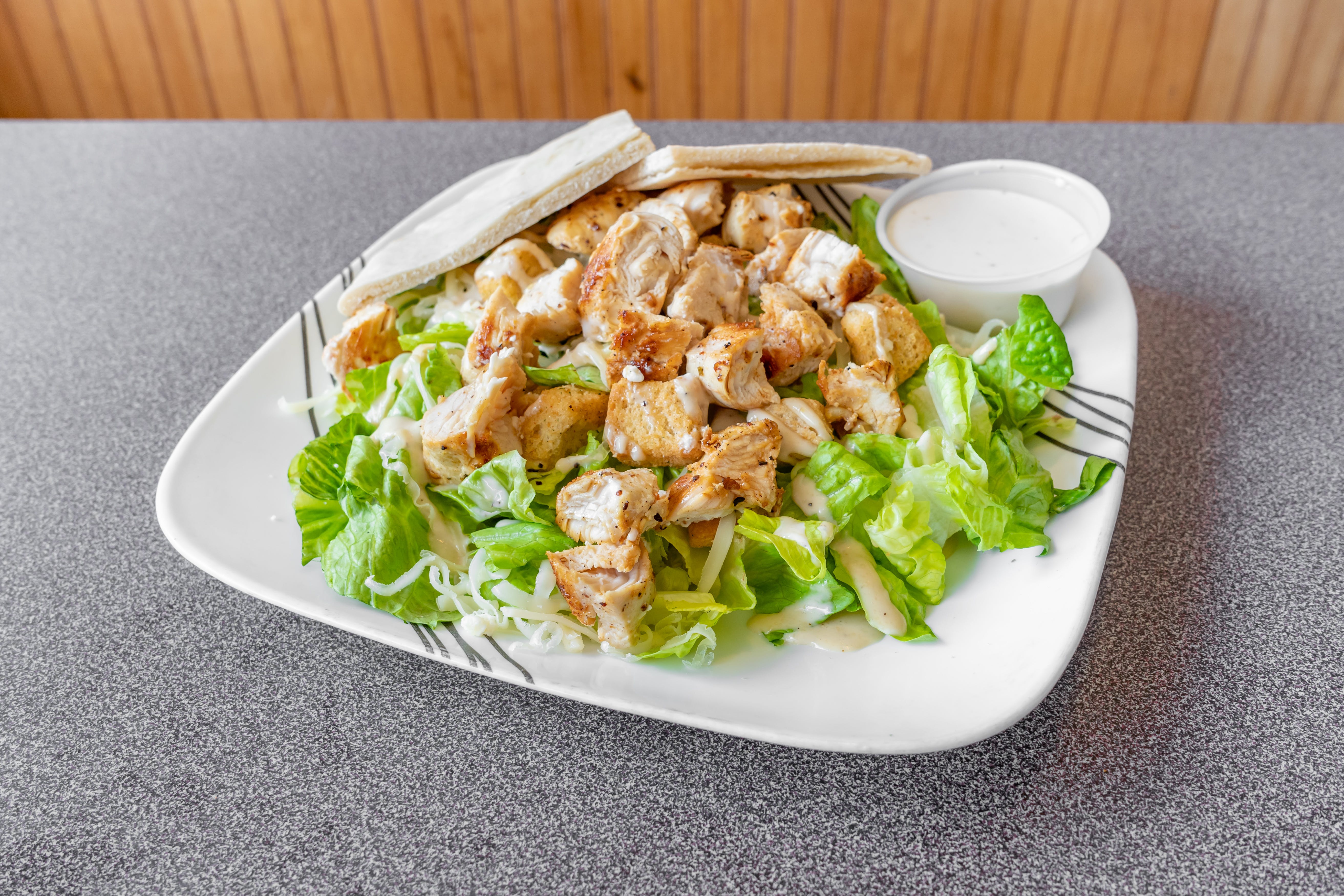 Order Chicken Caesar Salad - Salad food online from Arlington House of Pizza store, Arlington on bringmethat.com