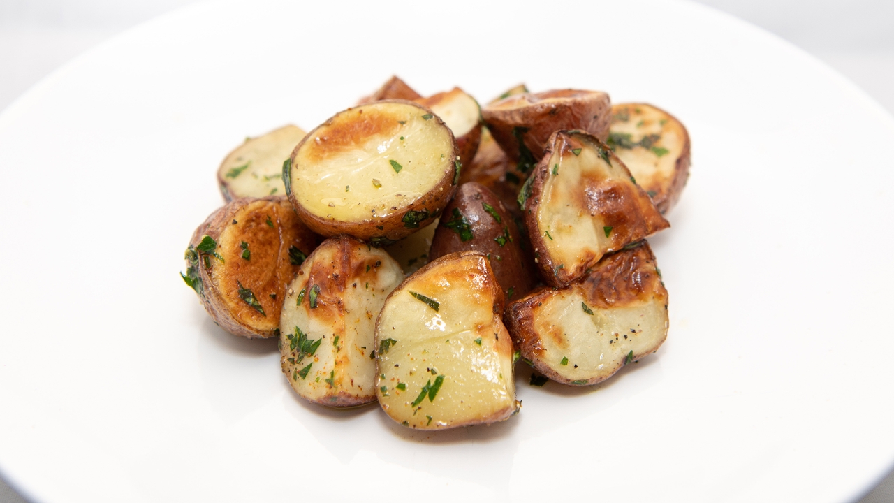 Order Herb Roasted Potatoes (Vegan) food online from Click Virtual Food Hall store, Houston on bringmethat.com