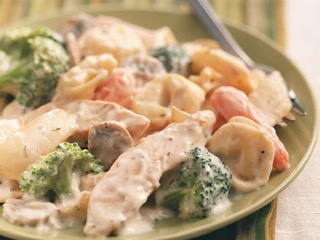 Order Tri-Colored Tortellini Alfredo with Grilled Chicken food online from New York Pizza & Family Restaurant store, Tannersville on bringmethat.com