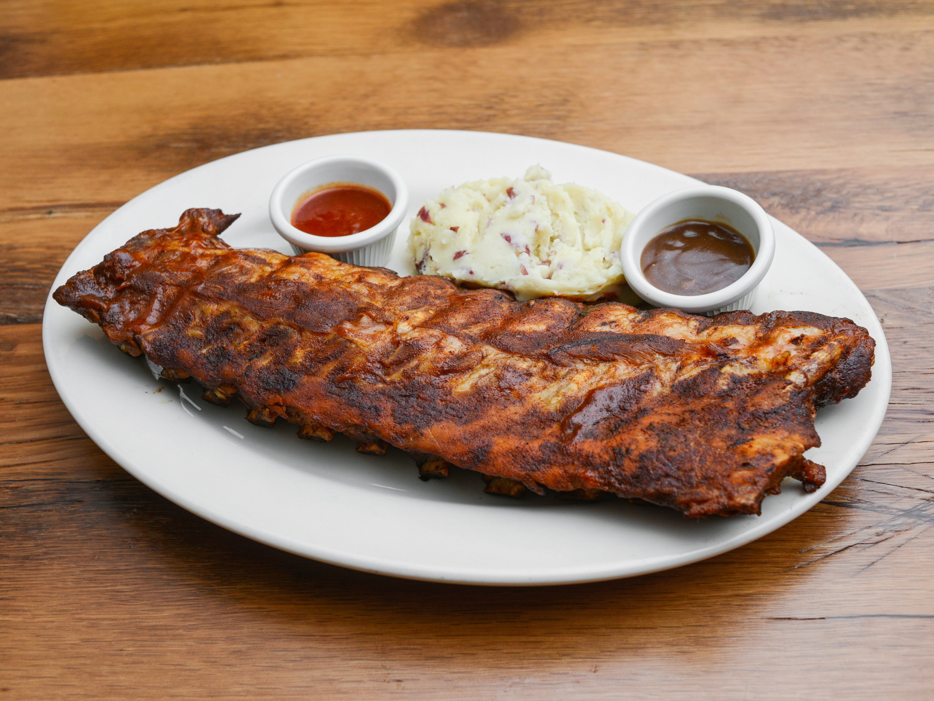 Order Baby Back Barbecued Pork Ribs-Whole Rack food online from Prospector Grille & Saloon store, Mount Laurel on bringmethat.com
