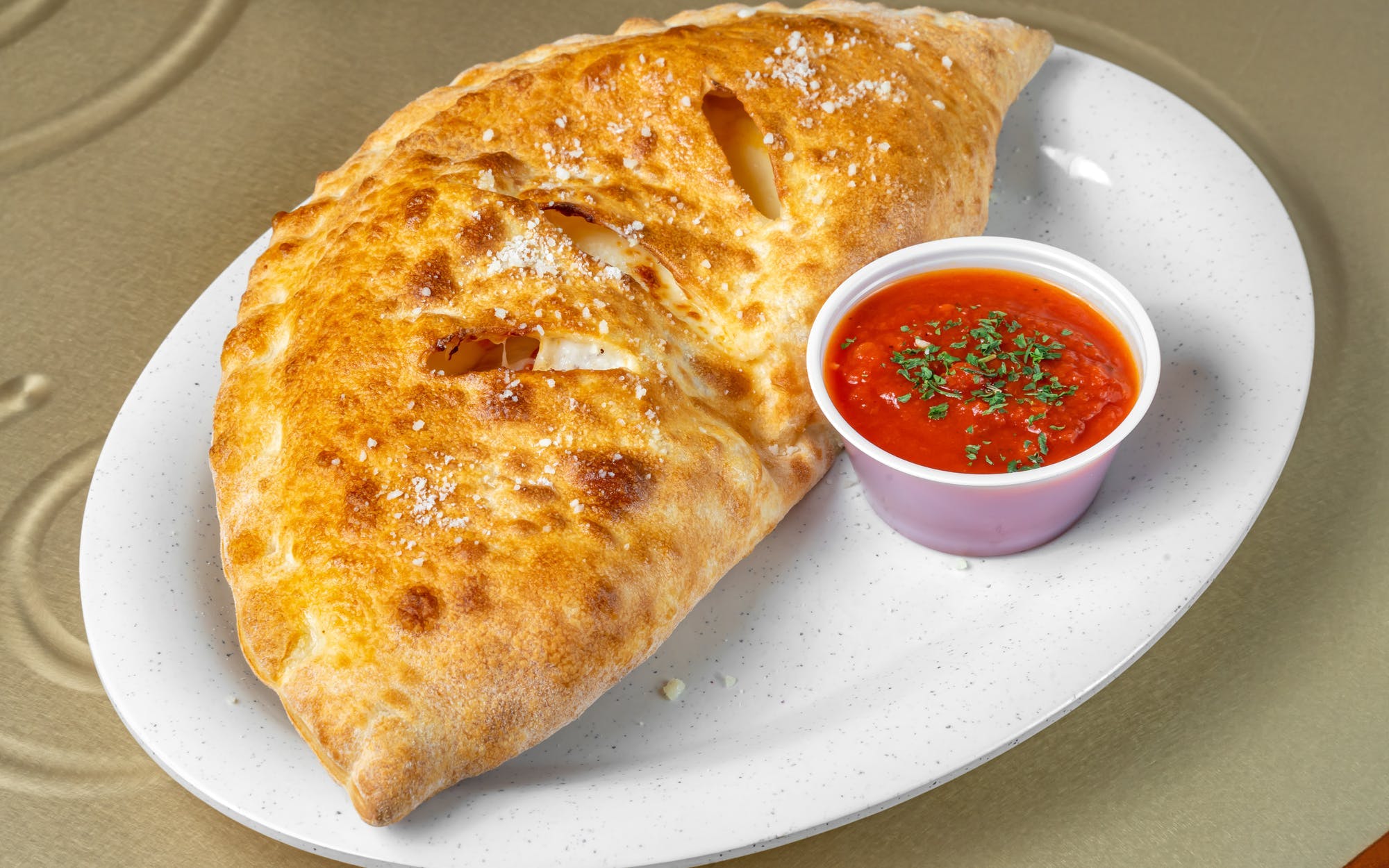 Order Spinach Calzone - Calzone food online from New York Pizzeria store, Grand Prairie on bringmethat.com