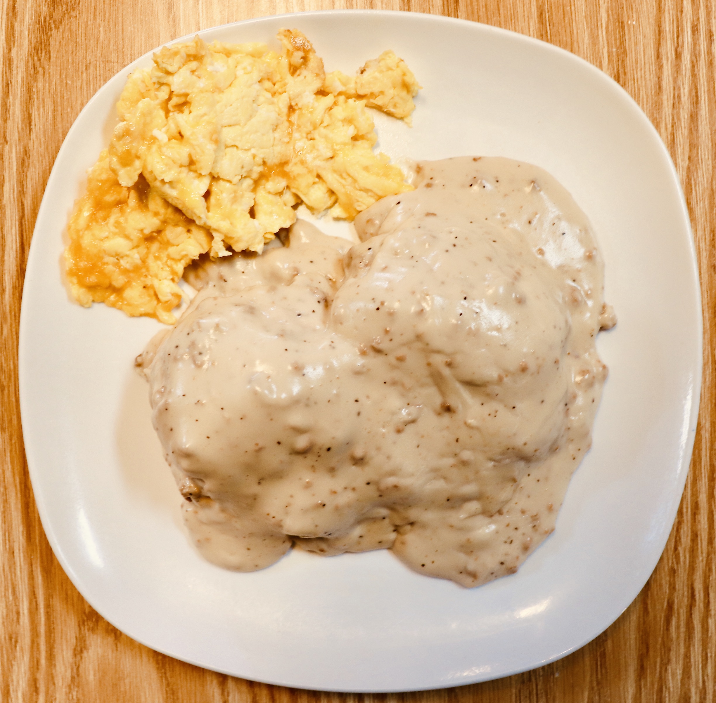 Order Sausage Gravy Biscuit with 2 Eggs food online from Charlie Cafe store, Norfolk on bringmethat.com