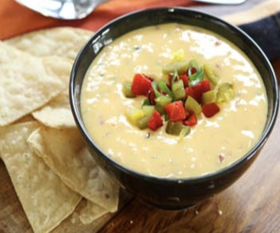 Order Cajun Queso and Chips food online from Nola Bar & Kitchen store, Chicago on bringmethat.com