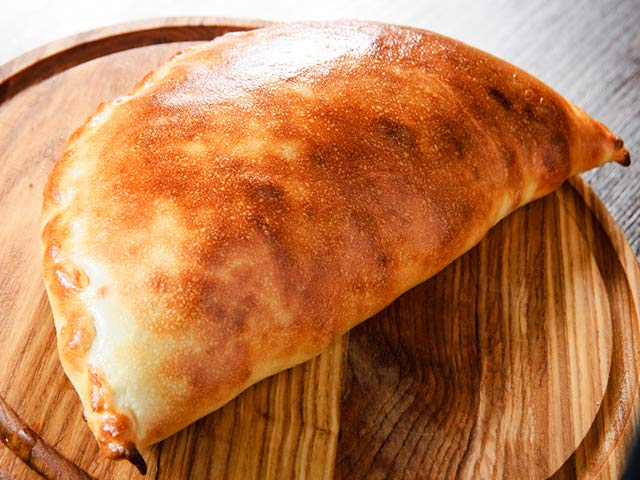 Order Calzone food online from Napoli's Pizza store, Virginia Beach on bringmethat.com